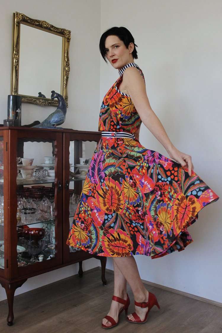 Floral patterned full-skirt dress in bold tropical colors.