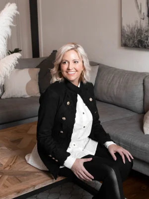 Austere Suede Touch Jacket in black , featuring intricate lace detailing along the front and cuffs, adorned with gold buttons for a refined, elegant finish.