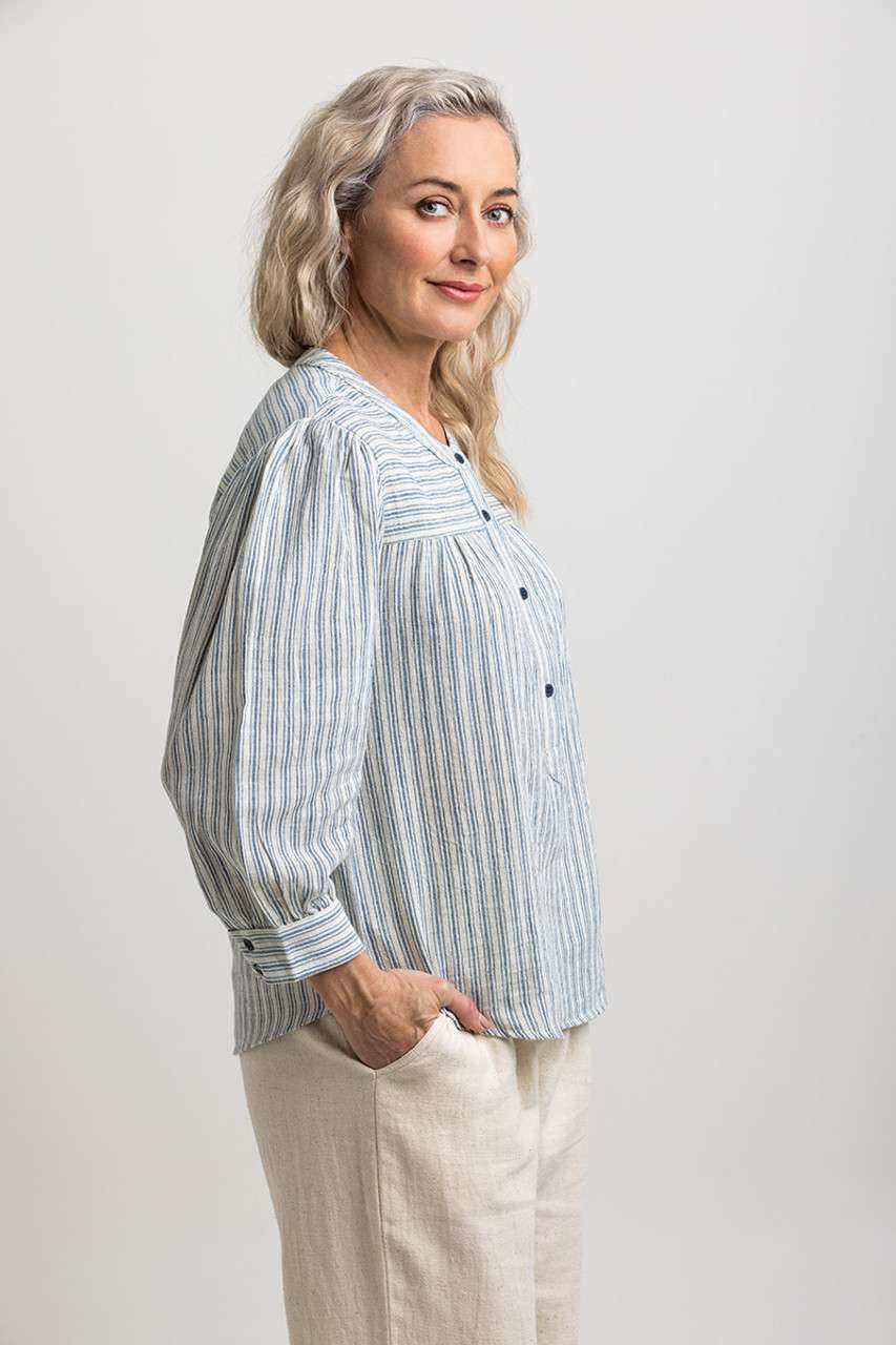 Light blue and white striped blouse with a partial button placket, loose fit, crafted from eco-friendly materials by Colouron Cotton.