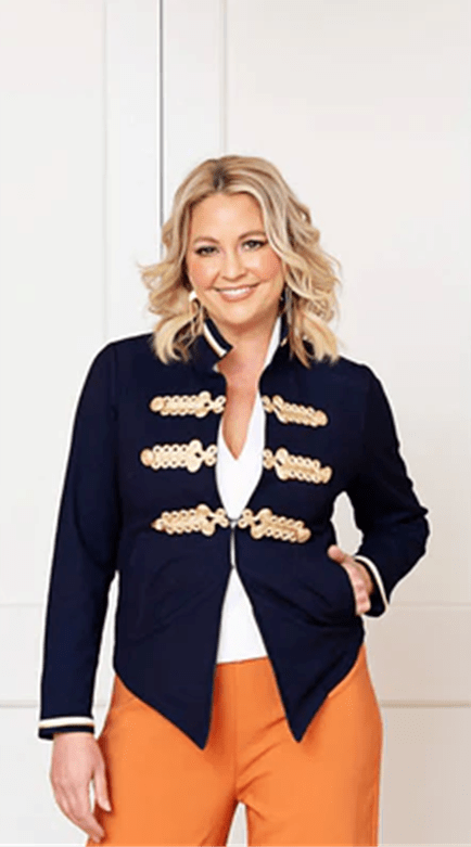 Twiggy Stretch Denim Jacket with Gold Brocade by Australian designer. A structured navy denim jacket adorned with intricate gold brocade detailing across the chest and cuffs.