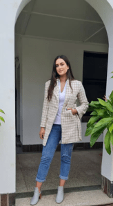 the Accolade Herringbone Coat in a taupe color with houndstooth pattern, creating a sophisticated and modern look