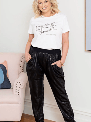 Astor and Tyne Black Jogger Pants - Sleek black jogger pants with a subtle sheen, featuring a herringbone-like texture for a modern, elevated look.