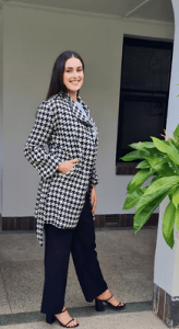 the Accolade Herringbone Coat in a classic black-and-white houndstooth pattern, creating a sophisticated and modern look