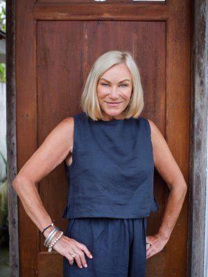 indigo linen top middle-aged woman showing front of sleeveless top