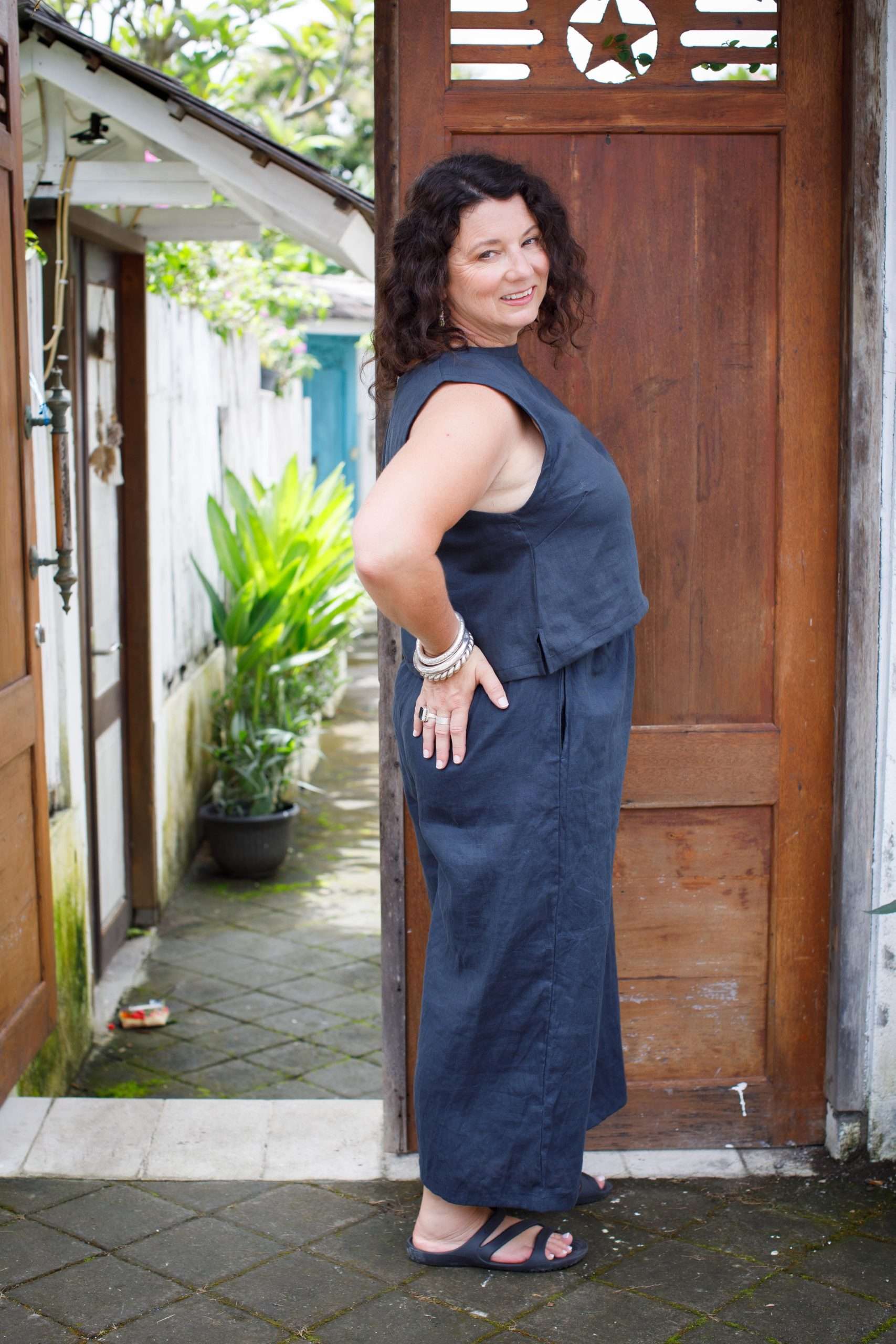 indigo linen top middle-aged woman showing right side of sleeveless top