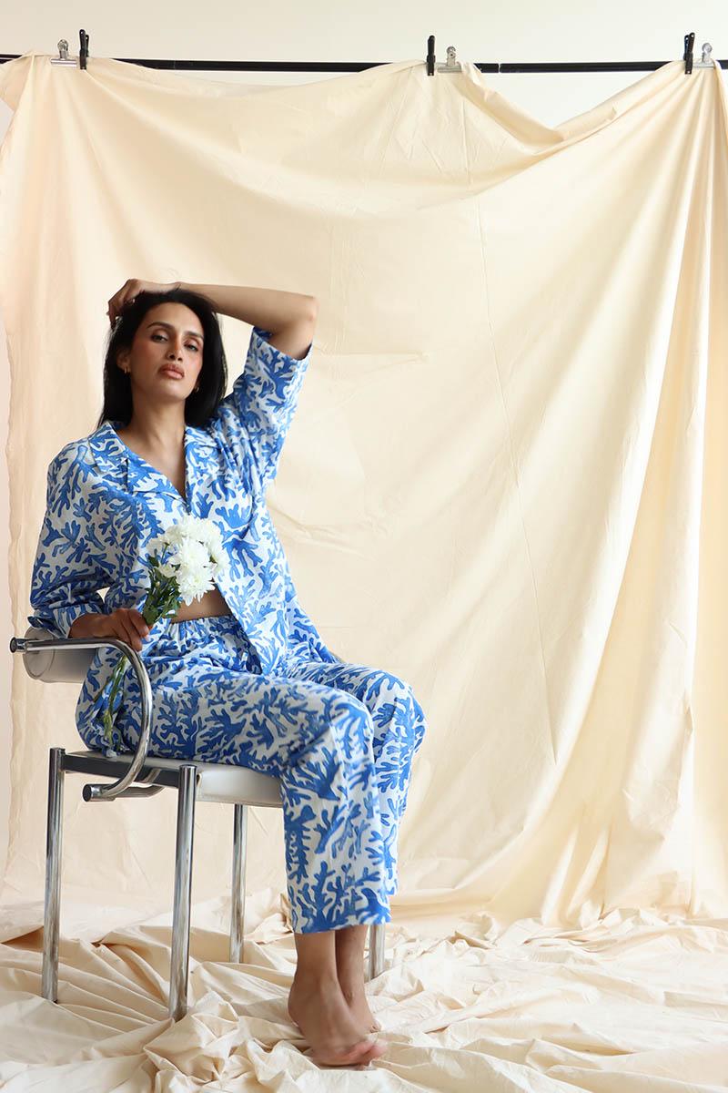 overall coral print in blue and white, the linen blend set has a revere collar button down shirt and drop shoulder 3/4 sleeves.