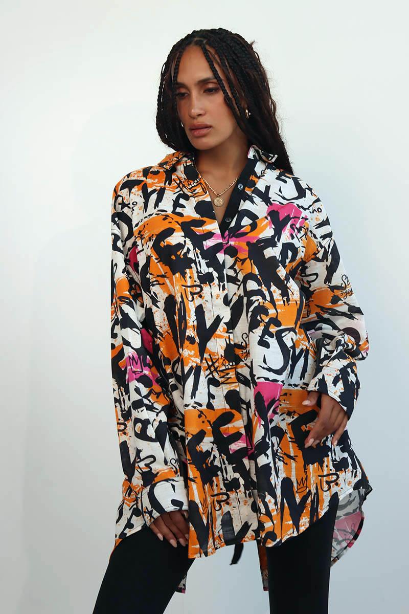 line collared drop shoulder shirt boasting a relaxed shoulder silhouette and a gracefully back slit, and lace up back detail