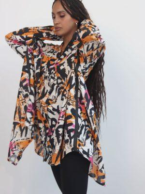 line collared drop shoulder shirt boasting a relaxed shoulder silhouette and a gracefully back slit, and lace up back detail