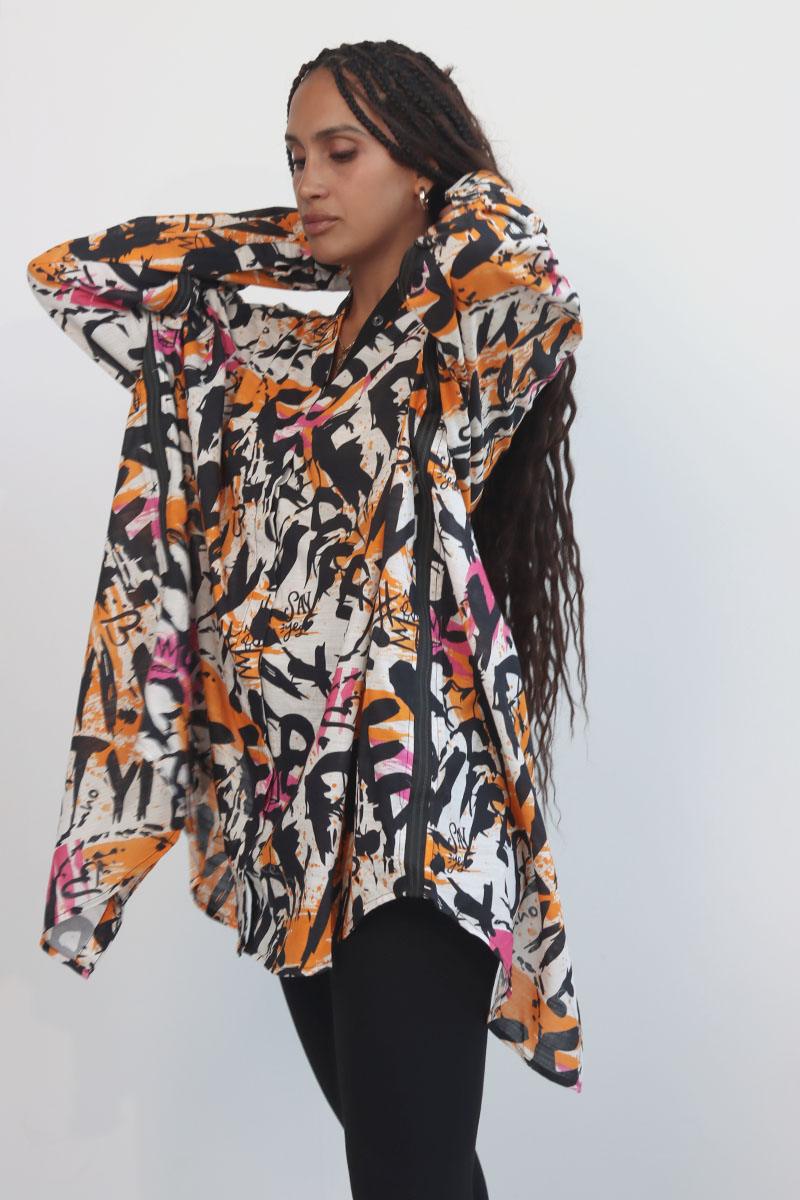 line collared drop shoulder shirt boasting a relaxed shoulder silhouette and a gracefully back slit, and lace up back detail